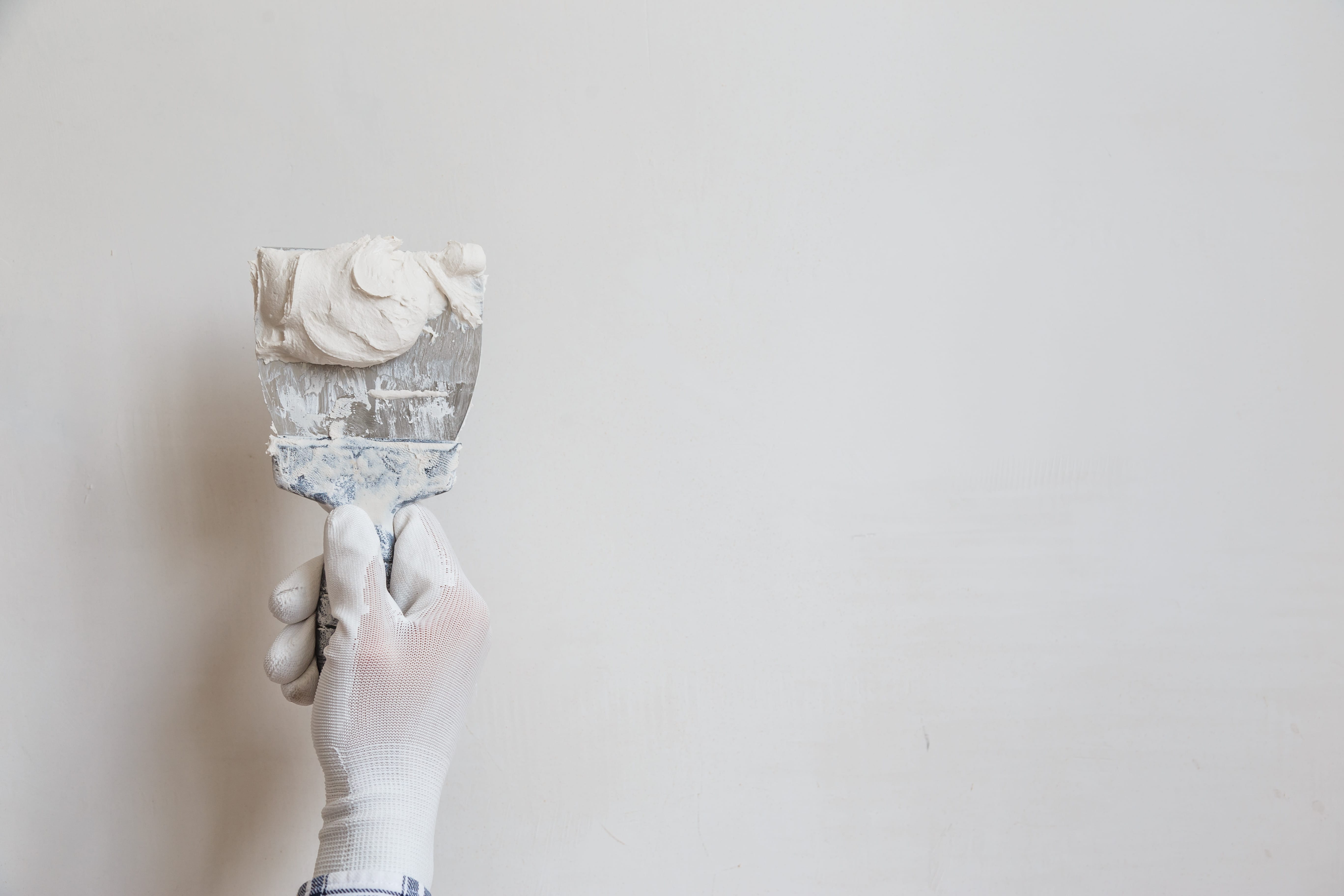 Paints 2 worker in white gloves performs plastering of the 2023 11 27 04 53 30 utc